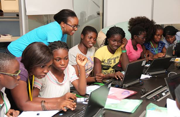 Students learning practical digital skills in an educational setting